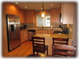 Spacious kitchen with granite counters and stainless appliances 