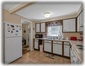 Fully-Equipped Kitchen Leading To Pantry & Third Bedroom