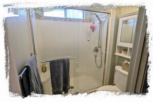 Primary bath has large walk in shower